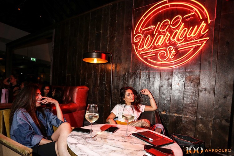 100 wardour st london pretty girls posing and having fun at a vip table brunette women 