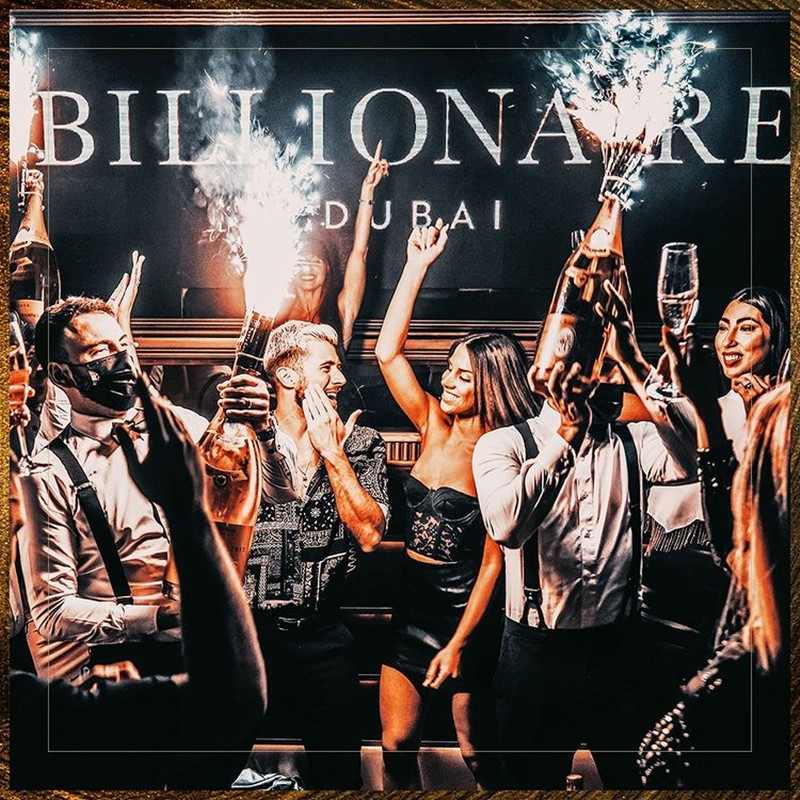 Billionaire Dubai club restaurant champagne bottles bubbles drinks package book vip table
