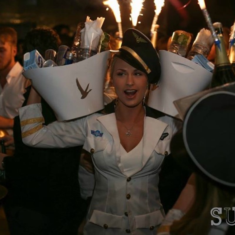 Table hostess Amanda bringing out the bottles at Suite dressed in a sailors costume