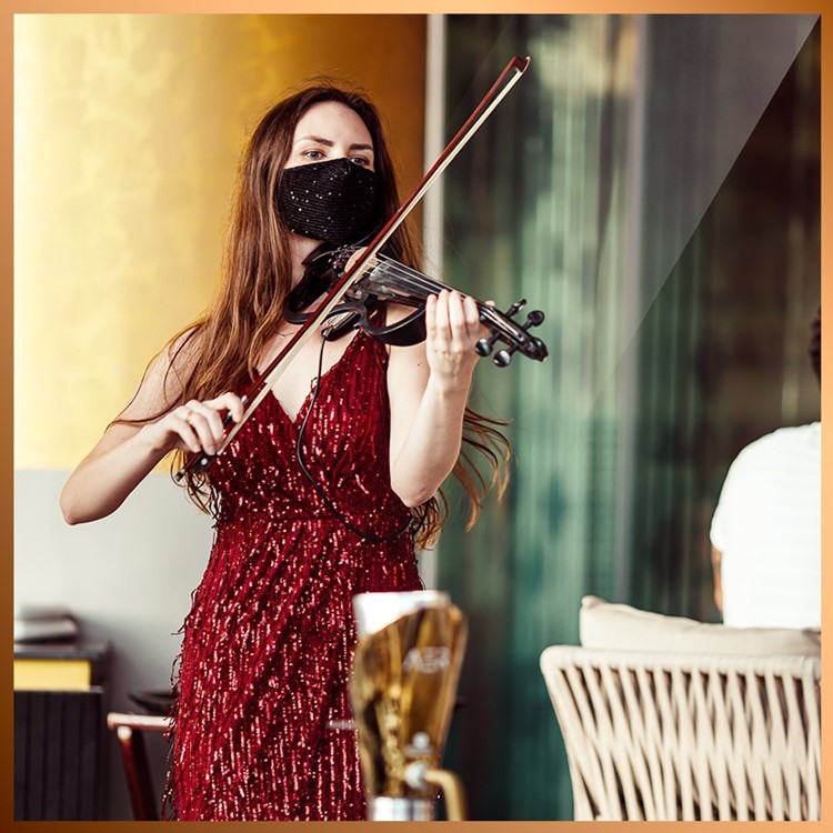Aer club Dubai party event live instrument singer mask violin 