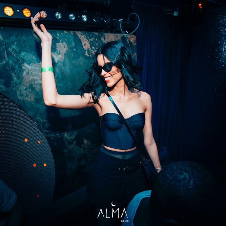 Alma nightclub Paris pretty brunette girl having fun dancing clubbing drinking dress code