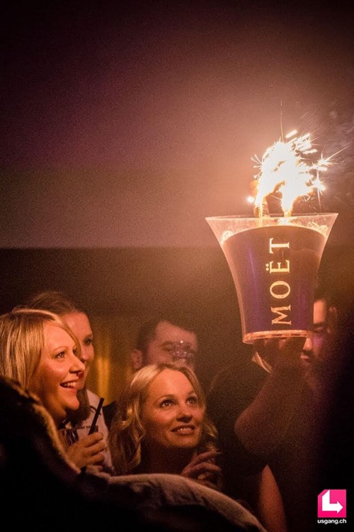 Aura Club nightclub Zurich blonde girls with big alcohol bottles vodka champagne