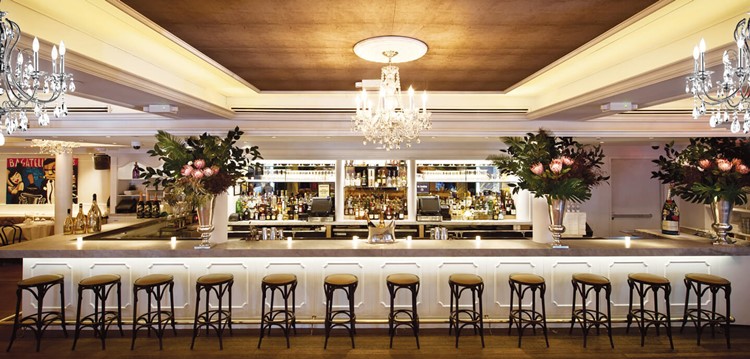 Bagatelle restaurant New York City bar view drinks alcohol cocktails fancy luxury interior design gold white chandelier