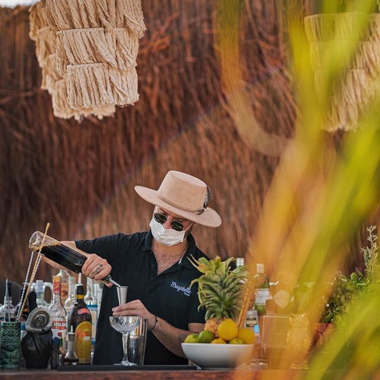 Bagatelle beach club Tulum barman mixing cocktails drinks alcohol 