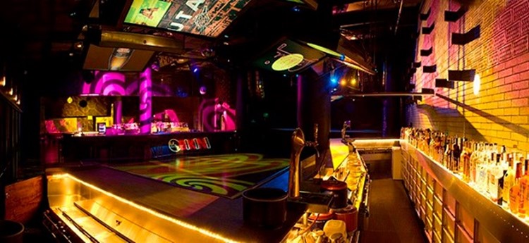 bikini nightclub barcelona view of the club with colored lights and empty dance floor and alcohol bar view