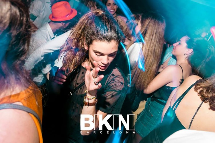 bikini nightclub barcelona full night party pretty brunette dancing in the crowd with blue lights