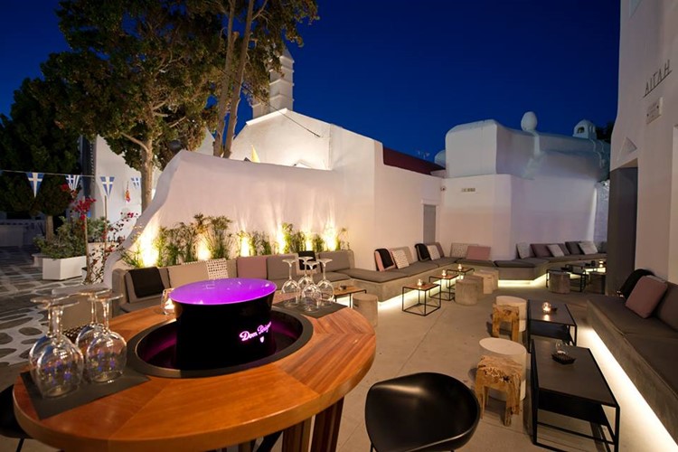 Bonbonniere nightclub Mykonos view of the exterior of the club terrace with couches and tables modern design