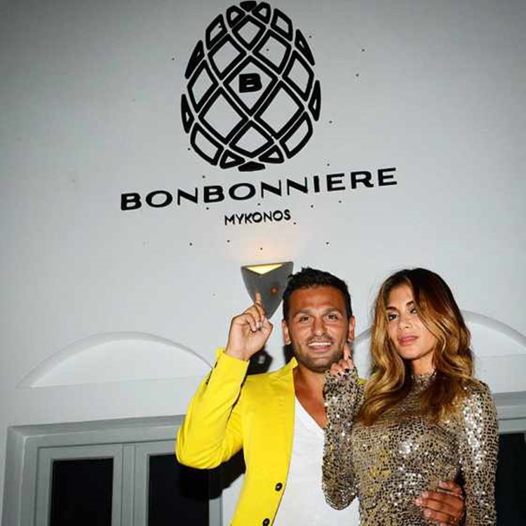 Bonbonniere nightclub Mykonos celebrity Joe Fournier with famous singer Nicole Scherzinger dressed in gold sparkling dress