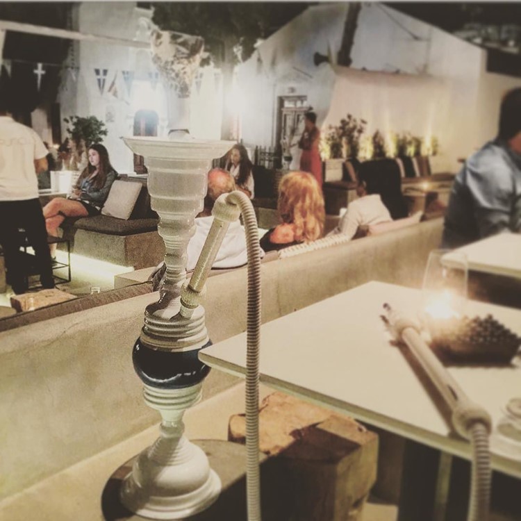 Bonbonniere nightclub Mykonos view of the exterior of the club terrace busy night smoking place