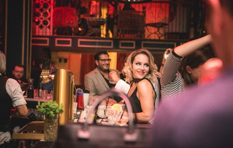 Bordelle nightclub Montreal event view of the bar pretty blonde woman and crowd