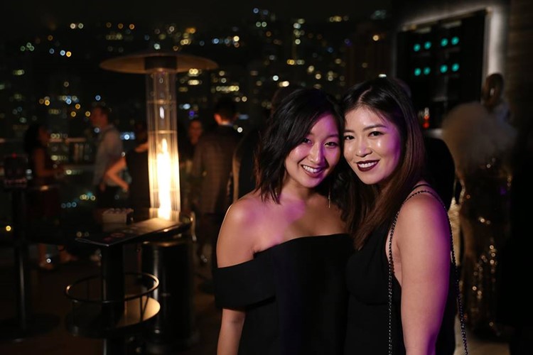 Ce La Vi nightclub Hong Kong two brunette asian girls having fun wearing black dresses