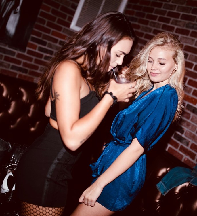Cathouse nightclub Los Angeles brunette blonde girls having fun dancing go out tonight dresscode mini dresses cocktails
