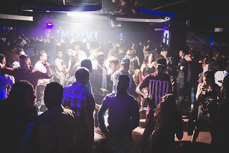 Catwalk nightclub Barcelona crowd dancing having fun drinking partying special effects