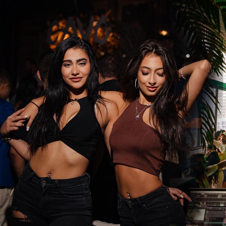Cavo nightclub Dubai pretty brunette girls having fun dancing partying clubbing