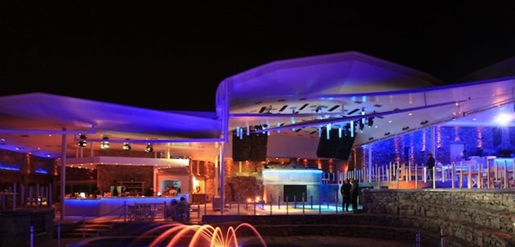 Cavo Paradiso nightclub Mykonos view of the empty club at night colored lights lighting up the place