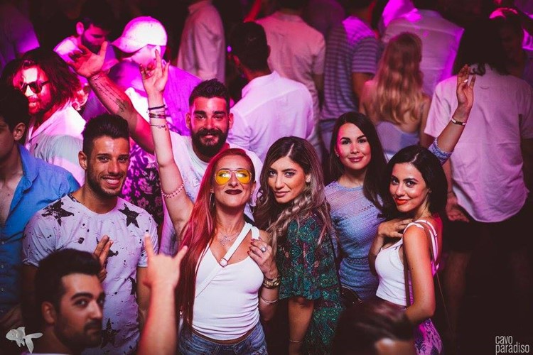 Cavo Paradiso nightclub Mykonos crowd of people dancing and having fun four pretty girls posing