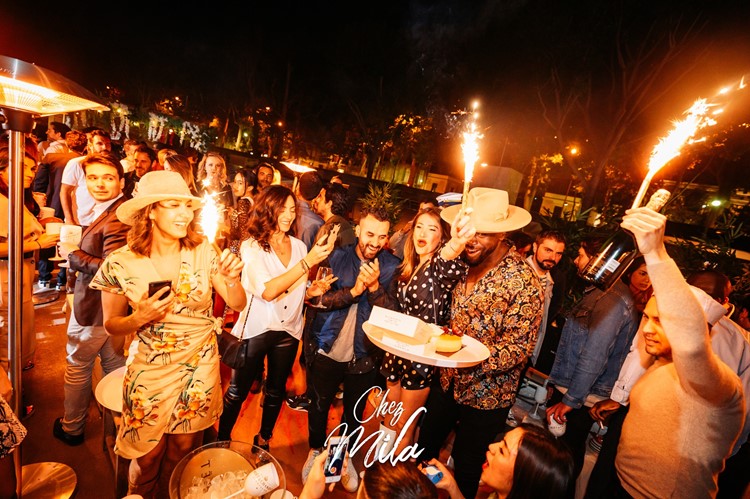 Chez Mila nightclub Paris celebrate have fun party all night book your table champagne vodka gin alcohol bottles special fancy