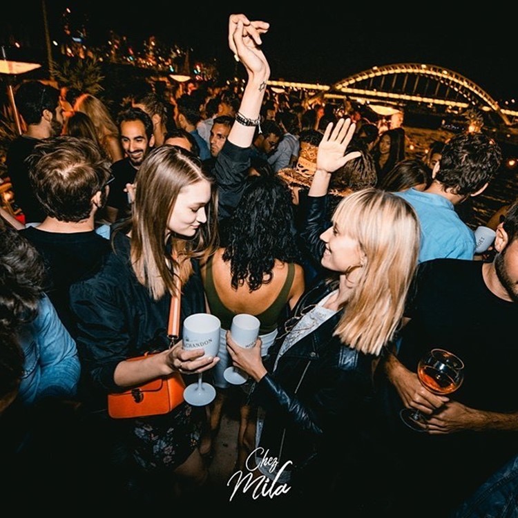 Chez Mila nightclub Paris boat party girls having fun drinking champagne where to go out tonight
