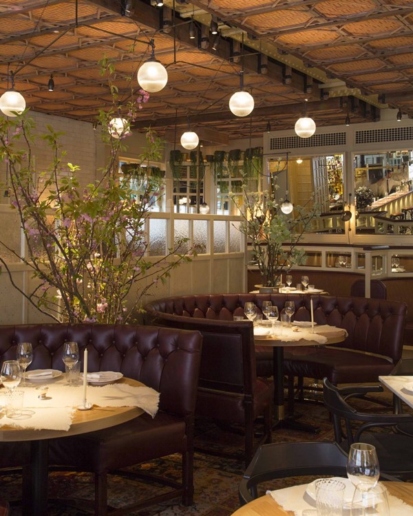 Chiltern Firehouse restaurant London best clubstaurant luxury interior design tables couch sit down area bar
