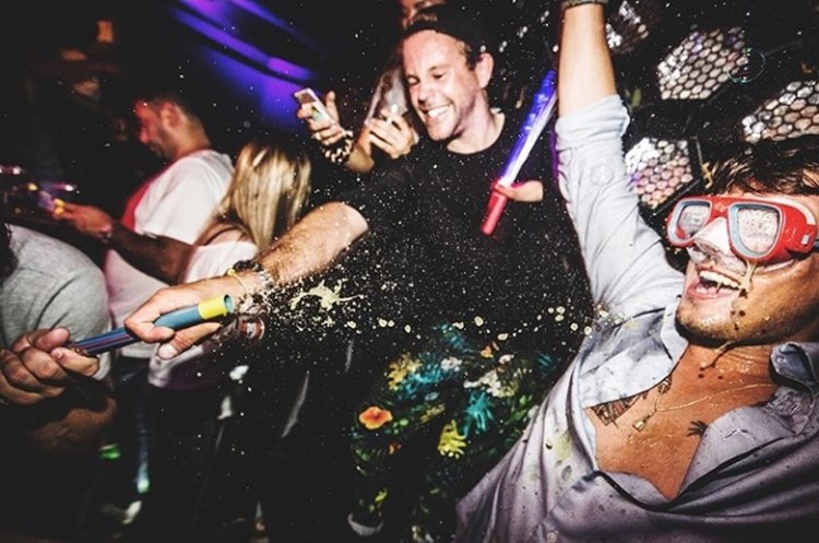 Chin Chin nightclub Amsterdam men having fun throwing alcohol