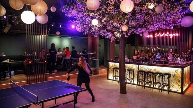 Chin Chin nightclub Amsterdam girl playing ping pong