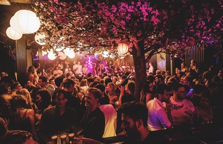 Chin Chin nightclub Amsterdam view of the main area people sitting at table chatting and drinking