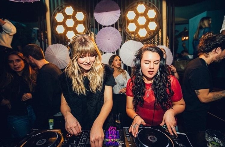 Chin Chin nightclub Amsterdam two dj girls blonde and brunette mixing music for fun