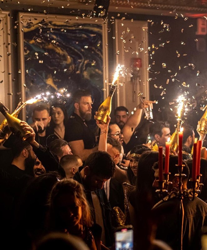 Chrystie nightclub Cannes two brunette and blonde girls drinking and having fun