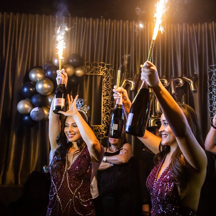 Clique Bar and Lounge in Las Vegas vip bubbles champagne luxurious parade celebrate table service bottles