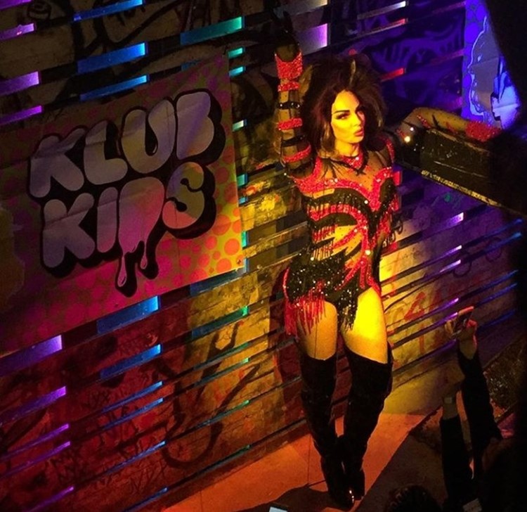 Club Nyx nightclub Amsterdam exotic dancer dressed in sexy costume red and black