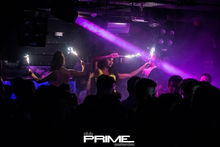 Club Prime nightclub Amsterdam exotic dancers holding sparkling lights
