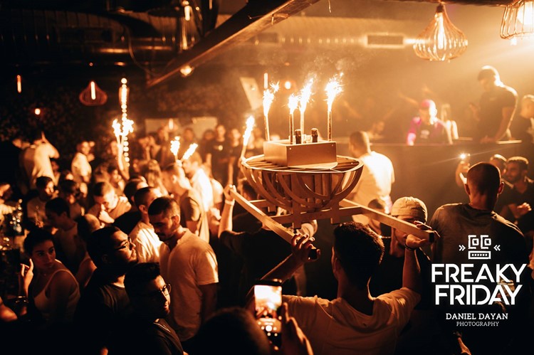 Coco nightclub Tel Aviv crowd having fun drinking partying