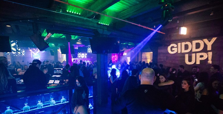 Cowboy nightclub Chicago view of the bar crowd having fun at party