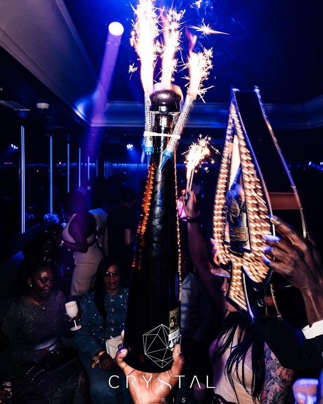Crystal Lounge nightclub Paris alcohol bottles parade vodka rum gin cognac champagne bubbles vip table service