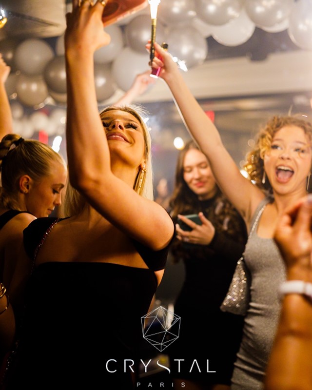 Crystal Lounge nightclub Paris pretty girls having fun guest list dancing drinking cocktails promoter table