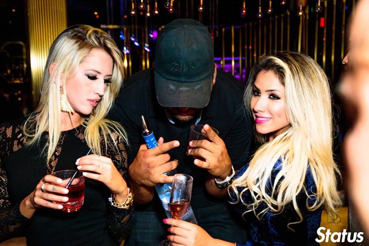 Cube nightclub Toronto sexy blonde girls drinking alcohol with man