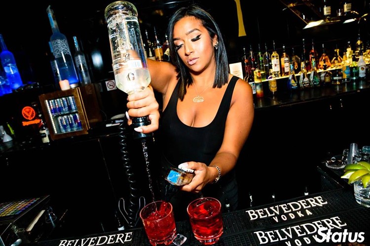 Cube nightclub Toronto sexy bartender pouring drinks vodka alcohol