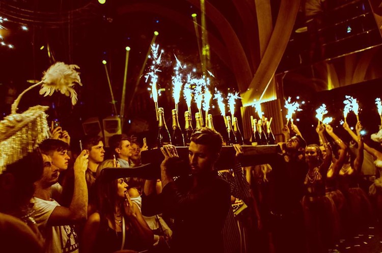 Dreamers nightclub Marbella alcohol bottles celebration book your table now vip area reserve fancy sitting party all night champagne