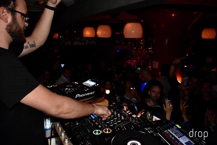 Drop nightclub Hong Kong dj mixing music for crowd having fun