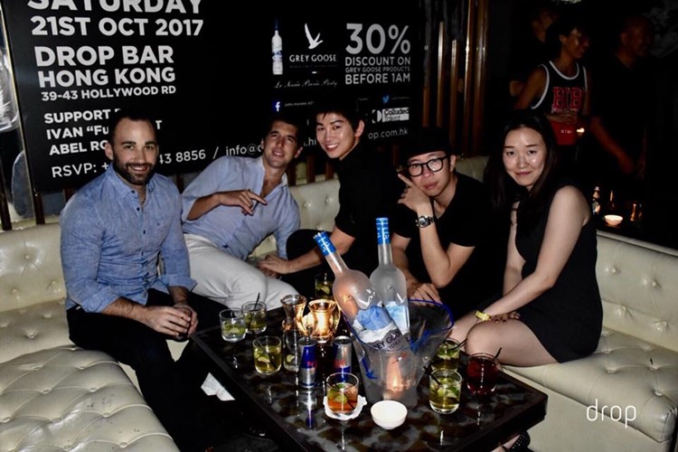 Drop nightclub Hong Kong group of girls and boys table booking bottles of alcohol vodka