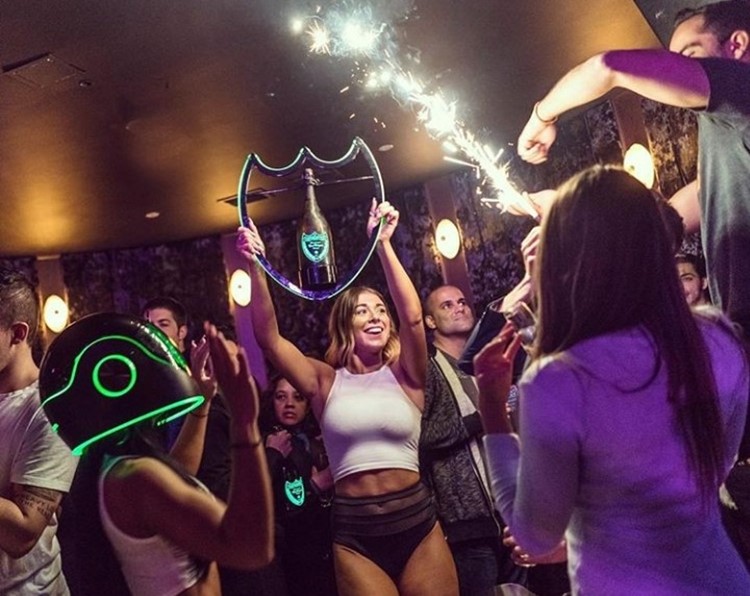Electric Hotel nightclub Chicago girls holding bottles of champagne