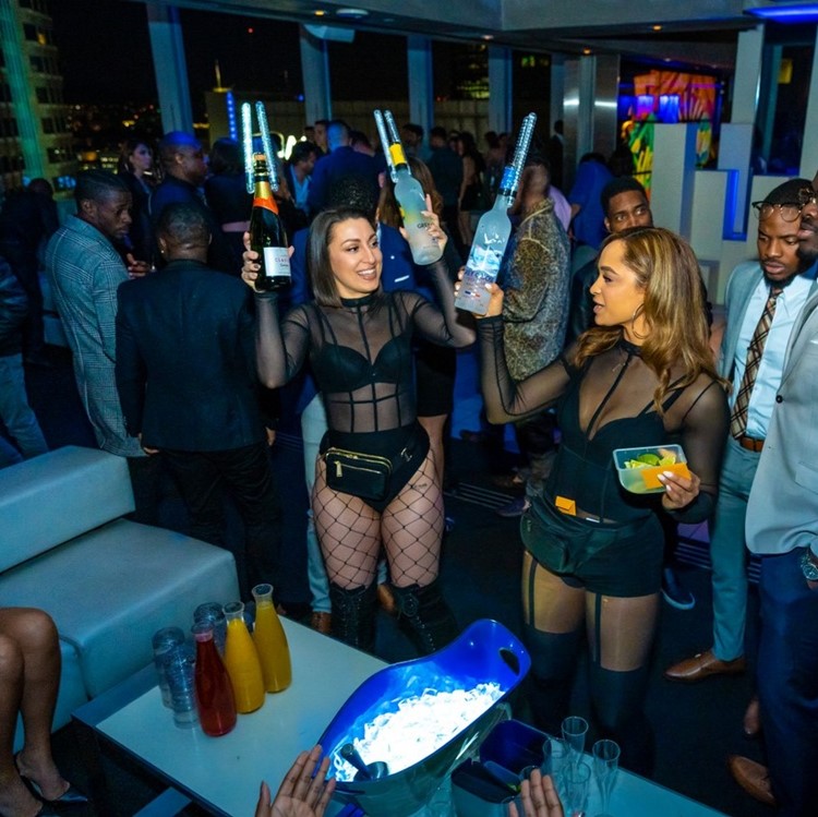 Elevate Lounge nightclub Los Angeles book vip table celebrate parade champagne bubbles alcohol bottles