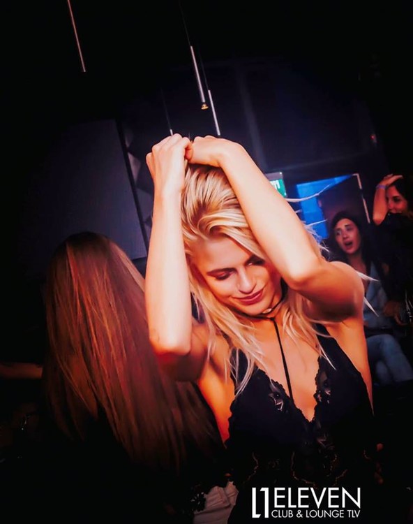 Eleven nightclub Tel Aviv pretty blonde girl dancing drinking alcohol expensive drinks guest list girls just wanna have fun nightout