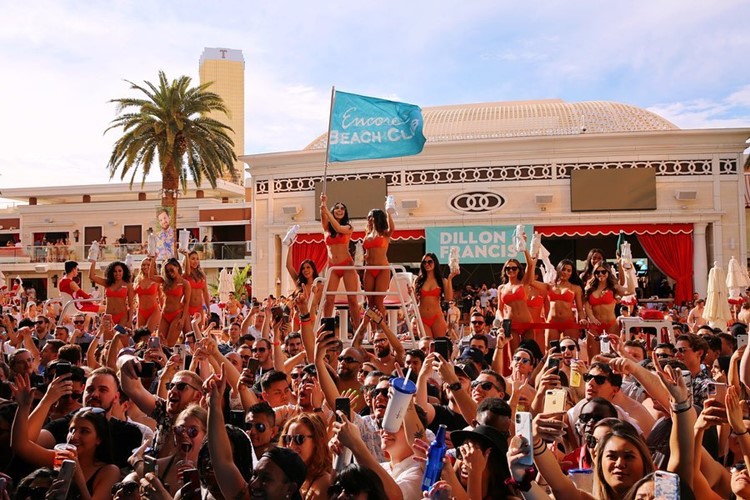 Encore Beach Club Las Vegas people dancing partying go out today have fun reserve vip exclusive beach swimming pool event