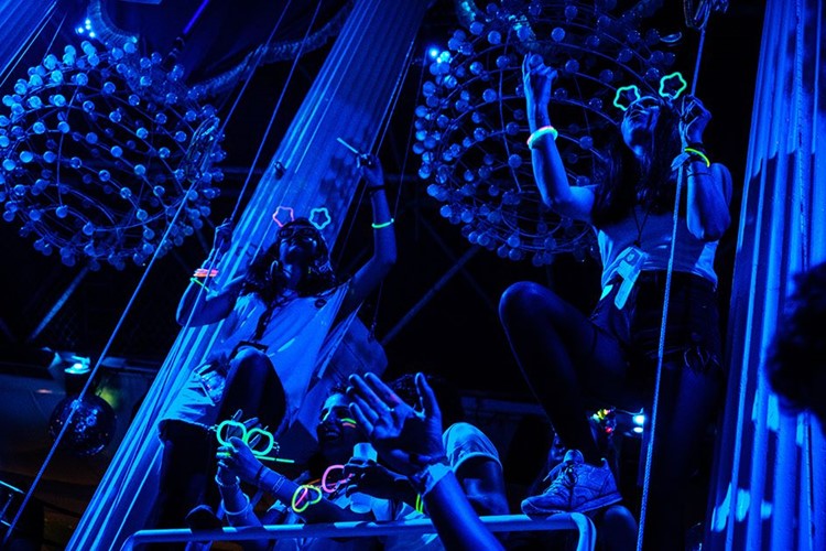 Es Paradis nightclub Ibiza blue light exotic dancers with neon lights on