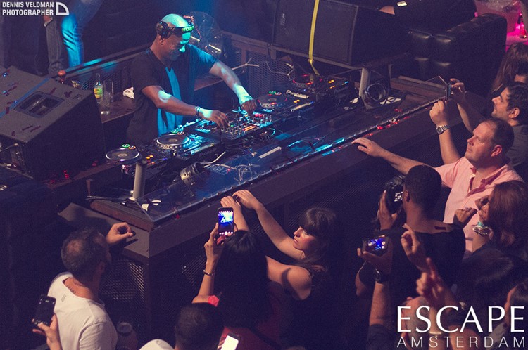 Escape nightclub Amsterdam dj mixing music people having fun