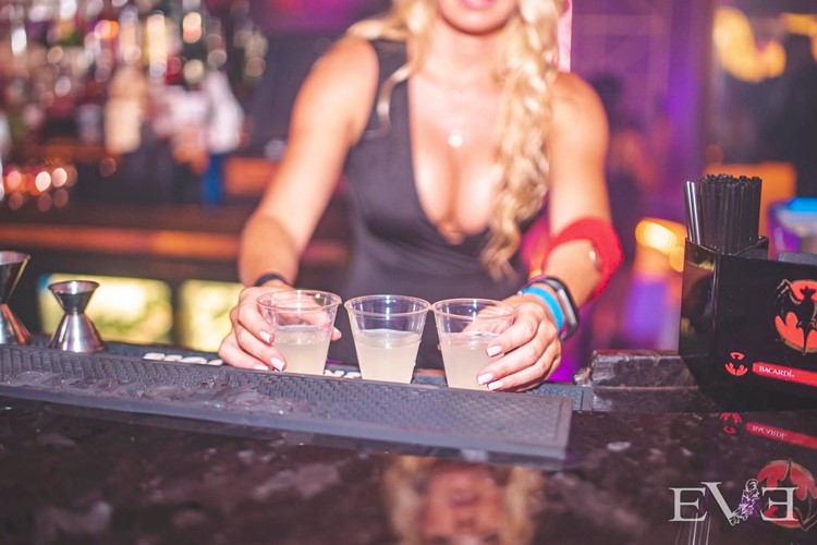 Eve Club nightclub Orlando party sexy bartender mixing drinks shots alcohol