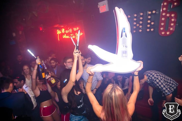 Everleigh nightclub Toronto sexy girls with champagne vodka bottles