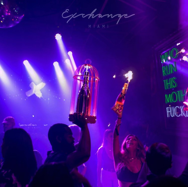 Exchange nightclub Miami bubbles champagne parade bottle service vip table