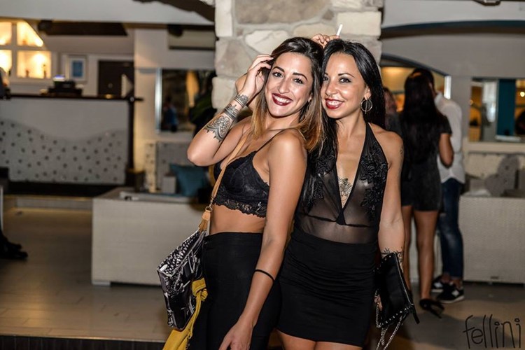 Fellini Club nightclub Milan sexy girls in black mini dresses